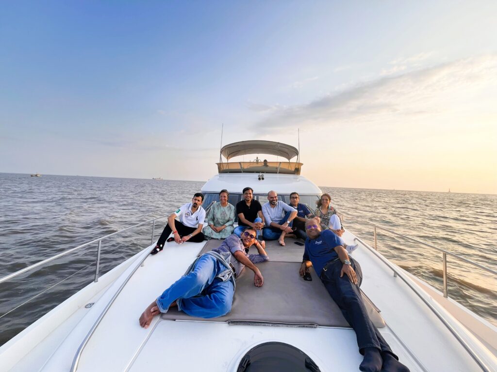 Corporate travelers in a meeting on a luxury yacht in Mumbai.