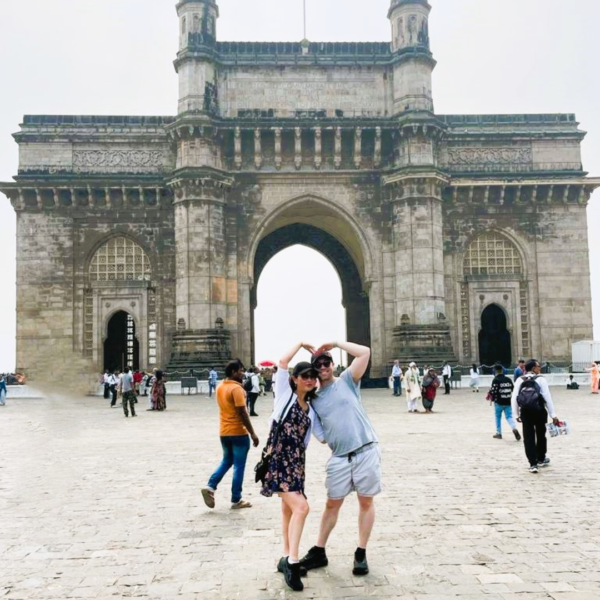 Guests enjoying the Essentials of Mumbai tour at the Gateway of India with a personal guide.